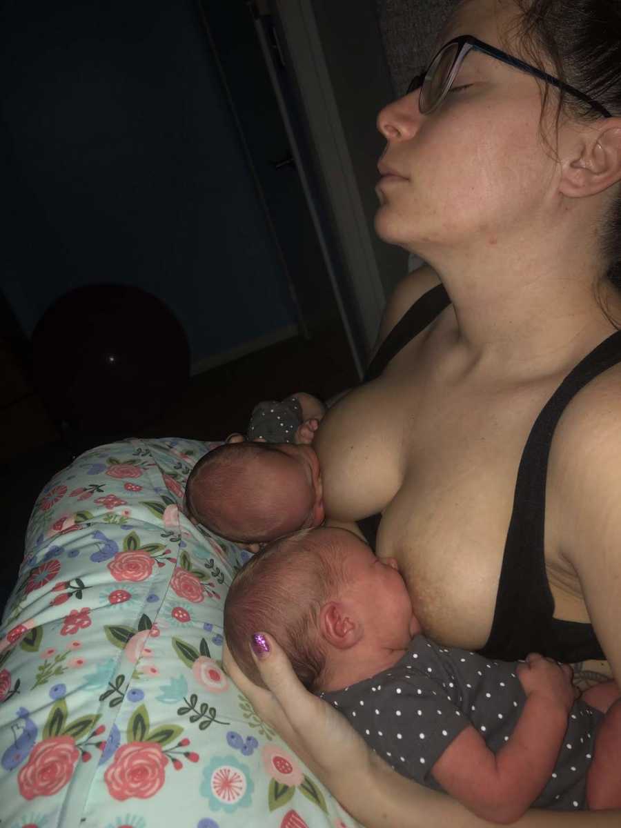 woman breastfeeding twins