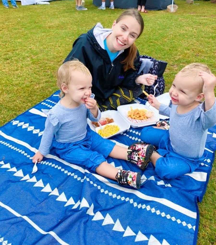 mom and her twins having a picnic