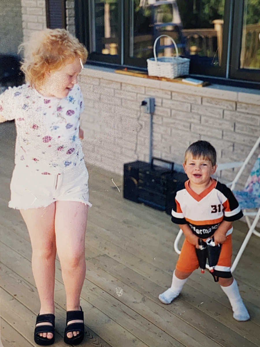 young girl and young boy outside