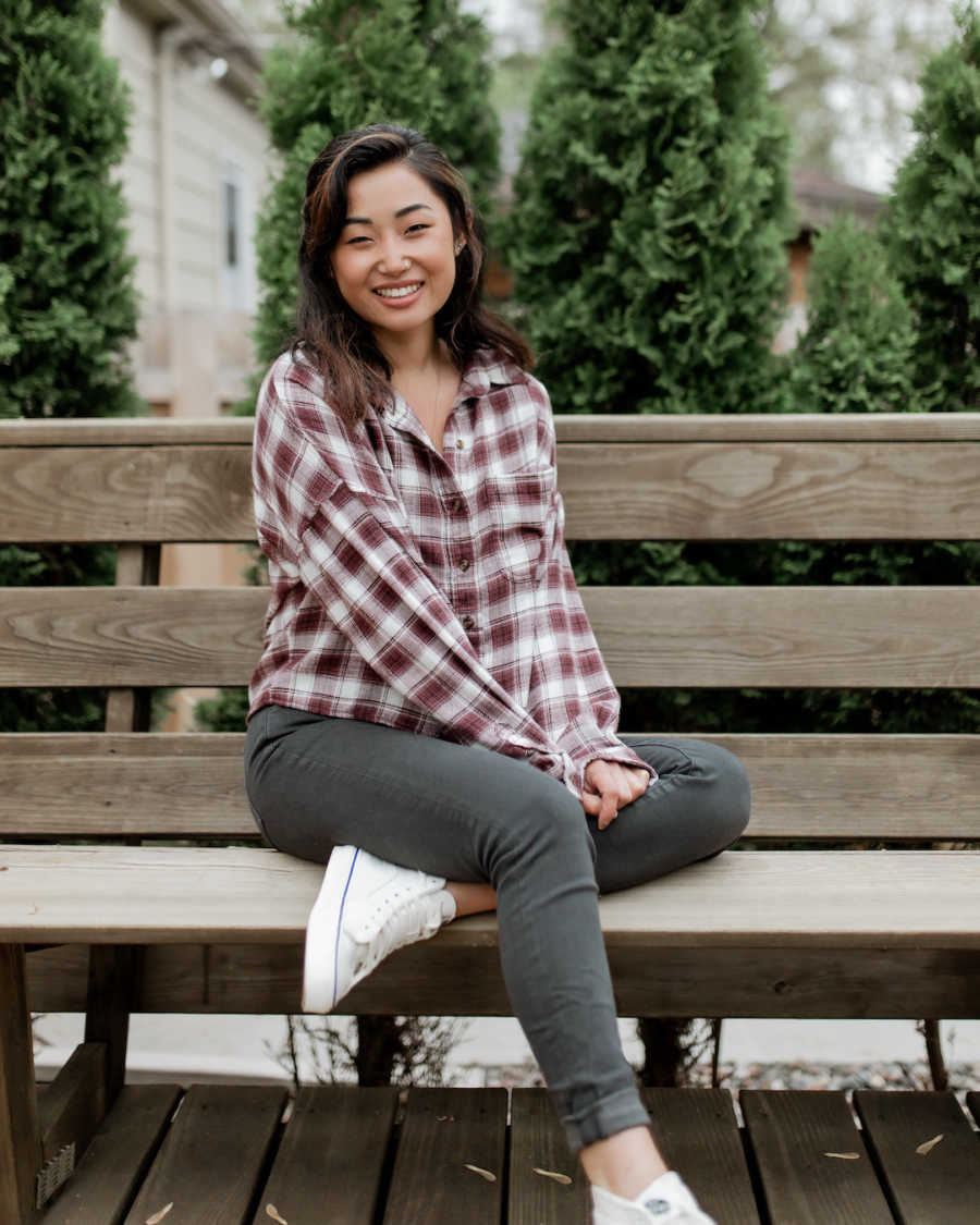 woman sitting on park bench