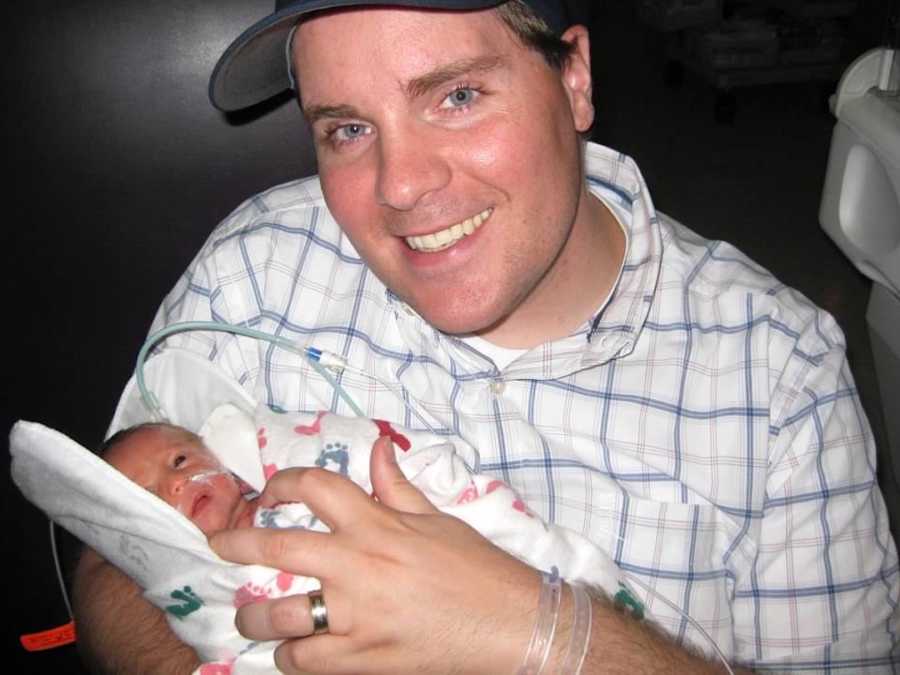 dad holding baby