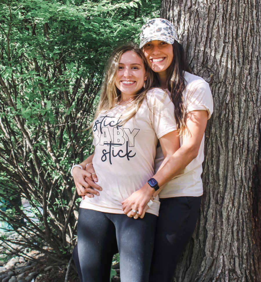 couple embracing in "stick baby stick"shirts