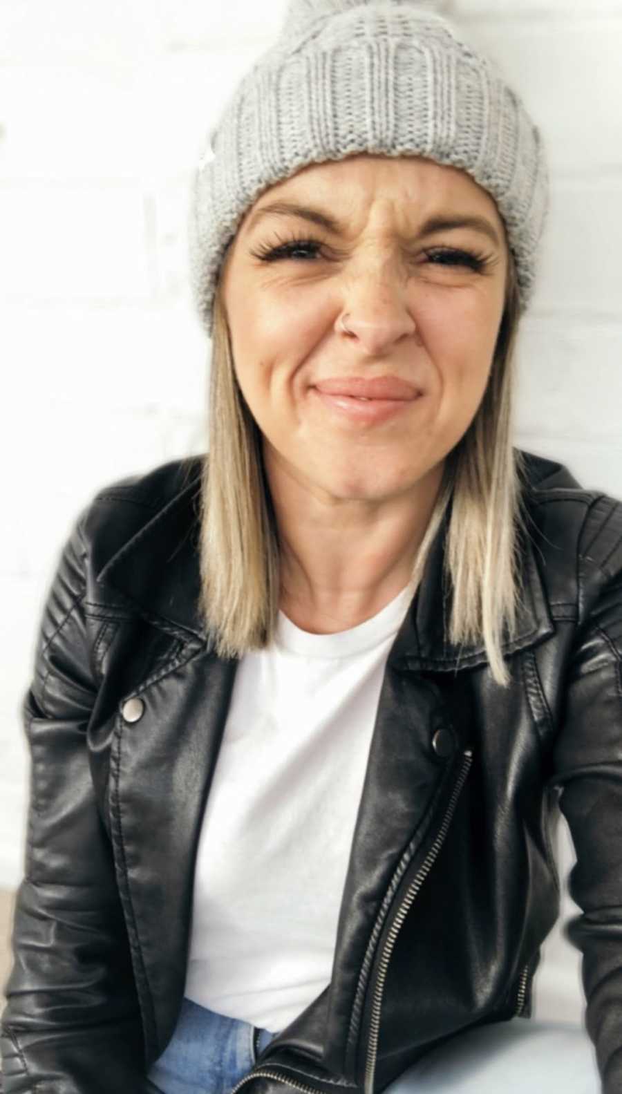 woman smiling in beanie