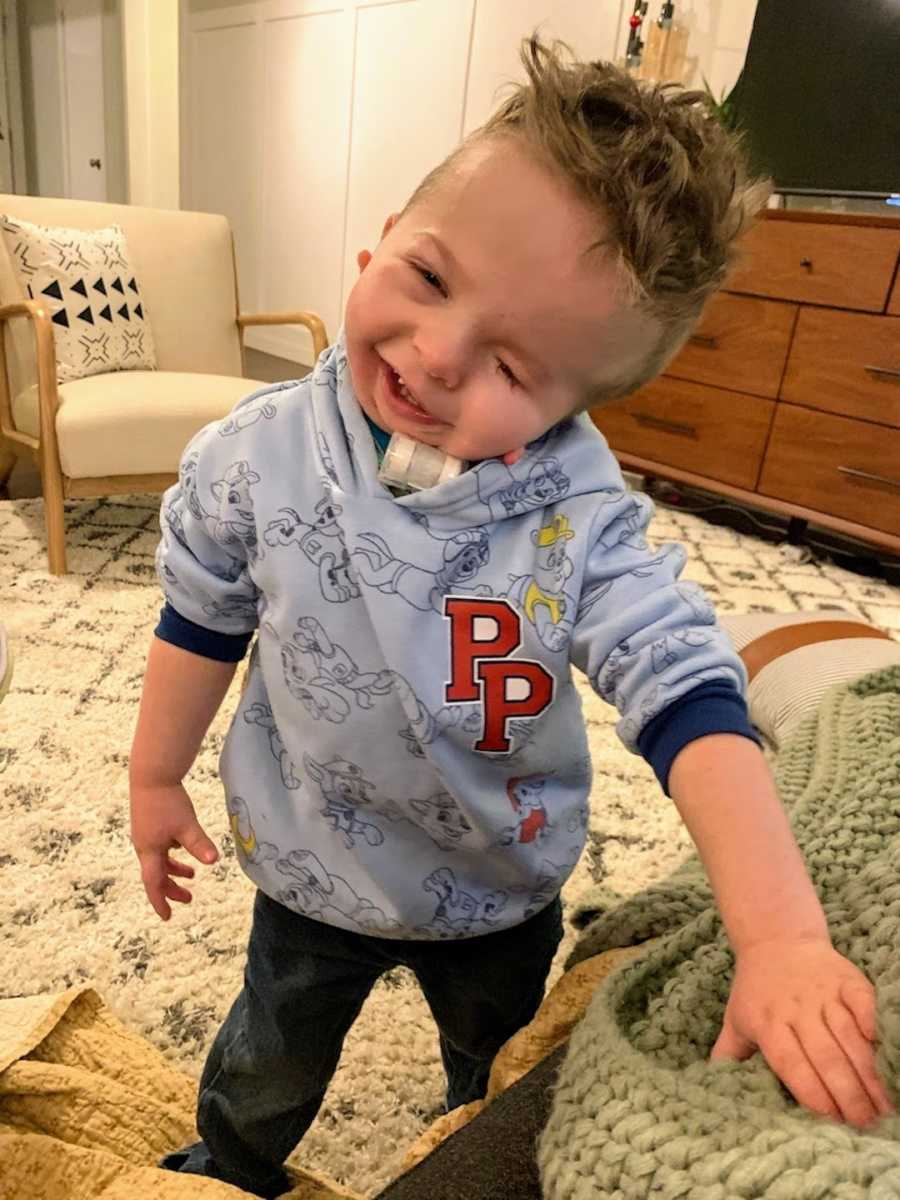 Young boy wearing Paw Patrol shirt smiling