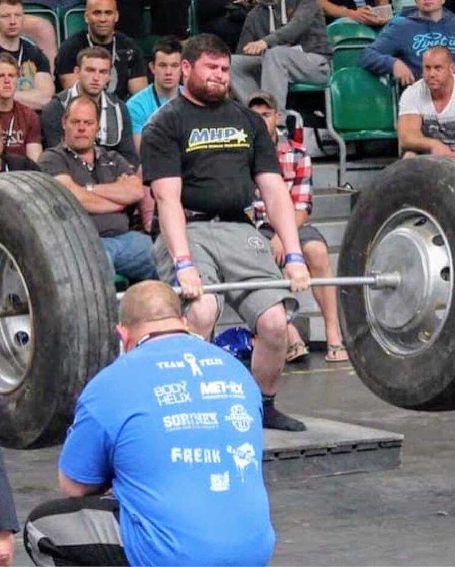 Man lifting weights at Strongman competition