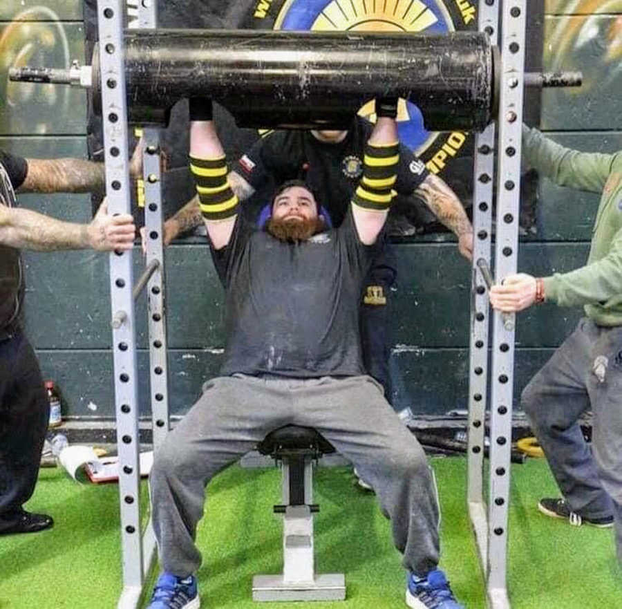 Man at weightlifting competition lifting weights