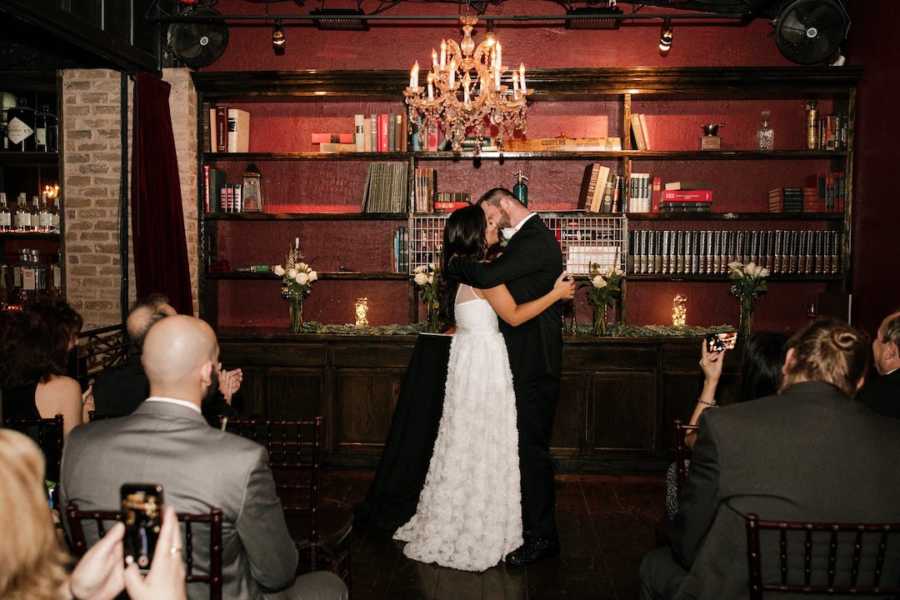 Bride and groom kissing at their wedding