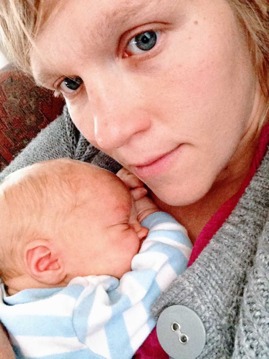 An autistic mother cradles her newborn son