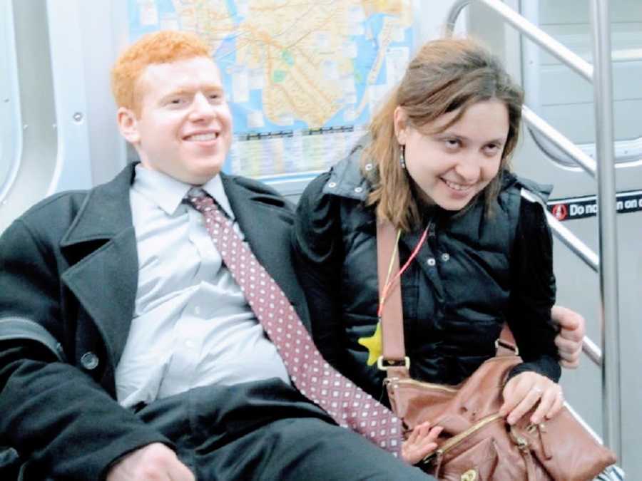 A comedian with social anxiety and his girlfriend sit together on a train