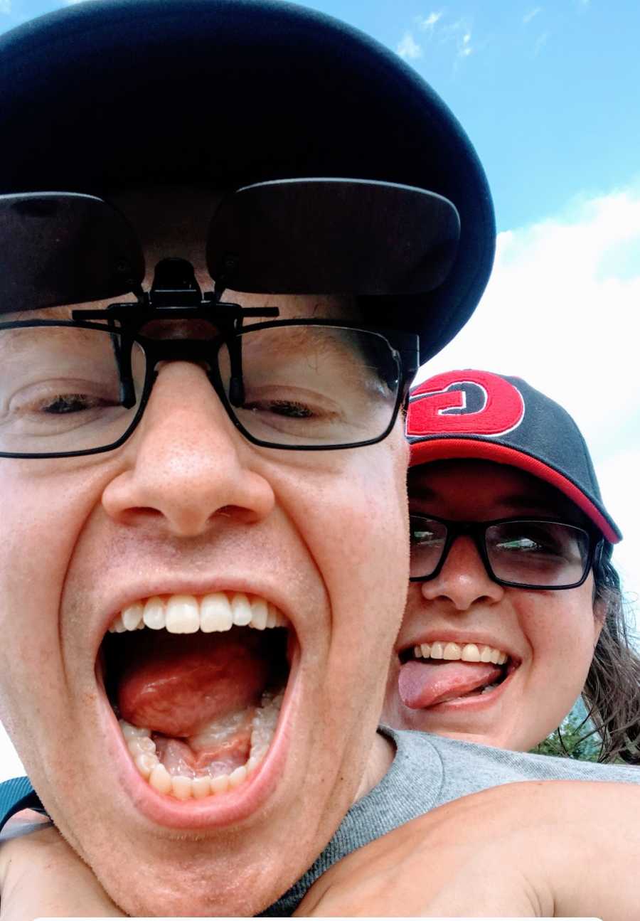 A comedian and his wife making silly faces at the camera