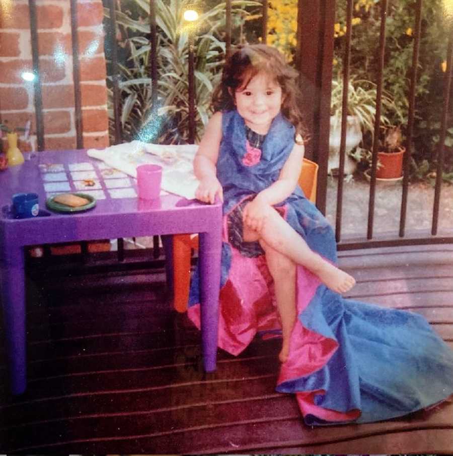 A young girl with undiagnosed ADHD sits at a purple plastic table