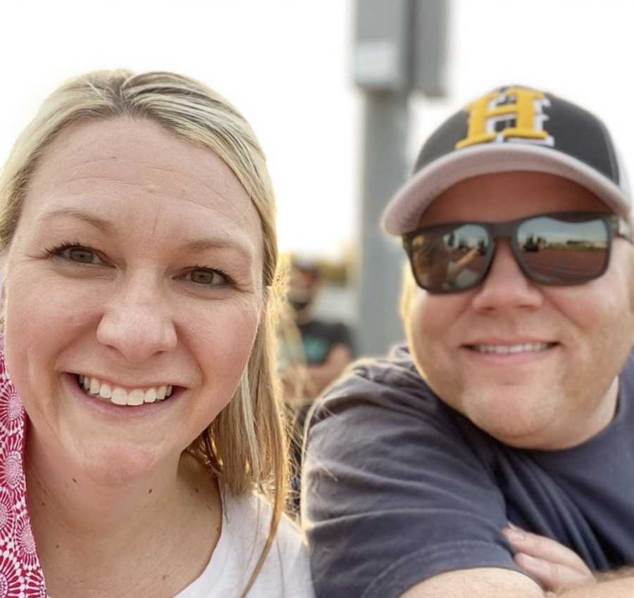 Husband and wife taking smiling selfie