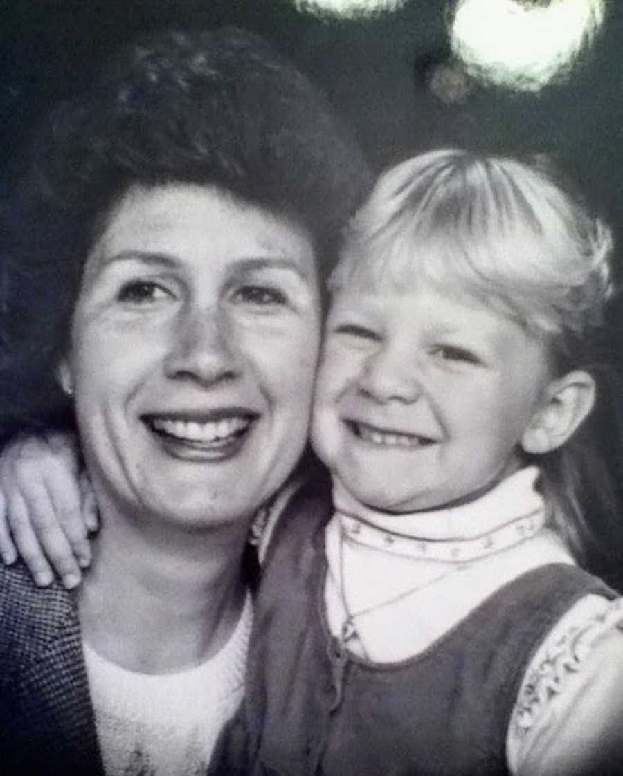 Black and white photo of mom and daughter with arms around each other