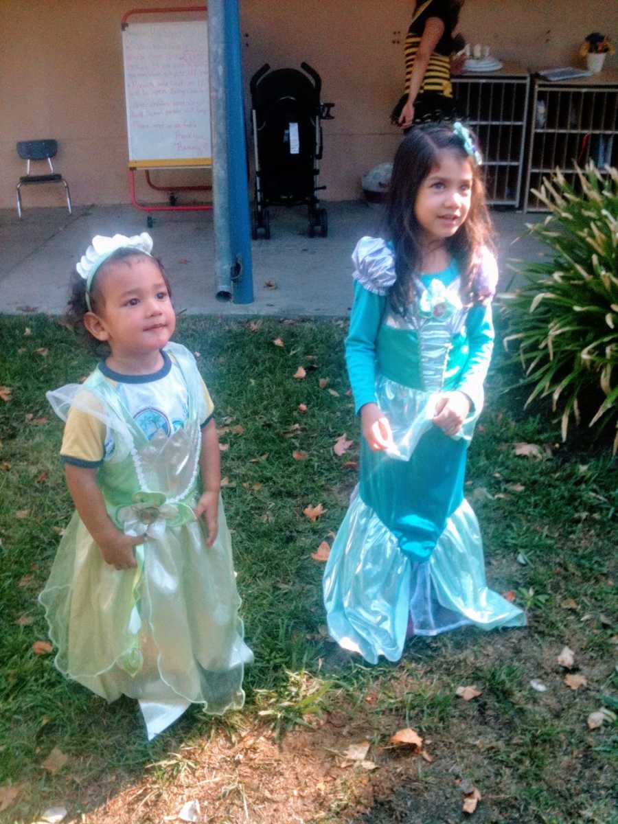 A little boy wears a princess costume and his sister wears a mermaid costume