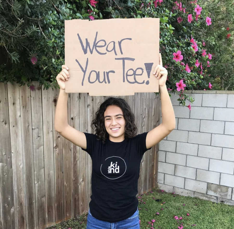 Girl holding a sign