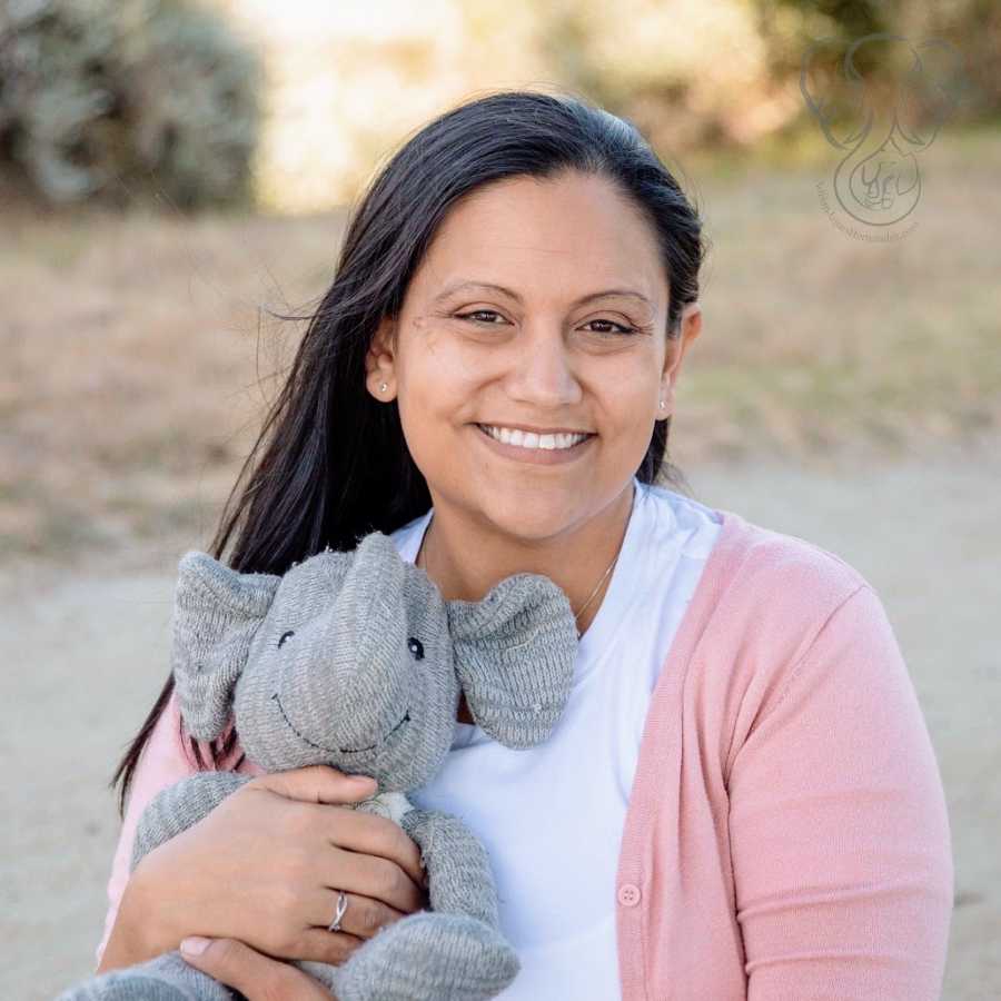 A single mother by choice holds her deceased son's toy elephant