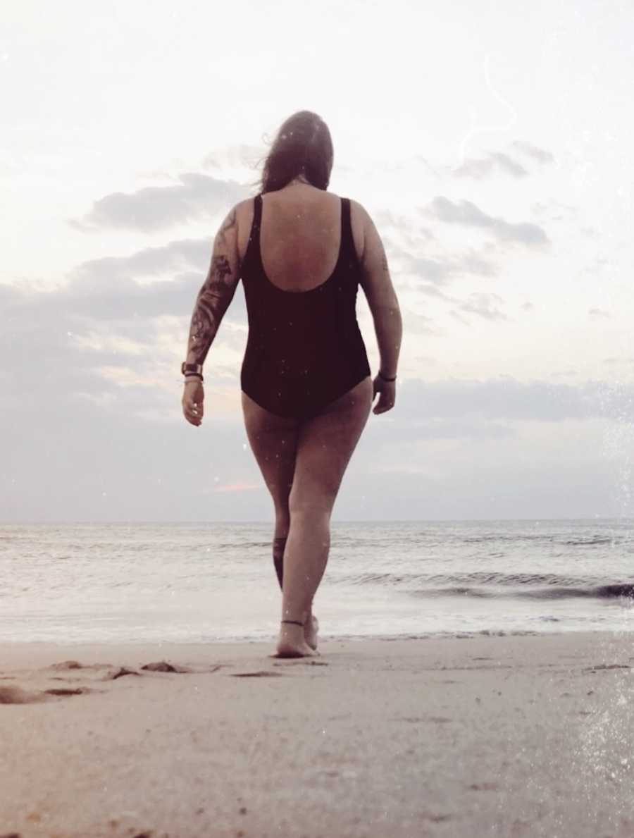 Woman walking on beach