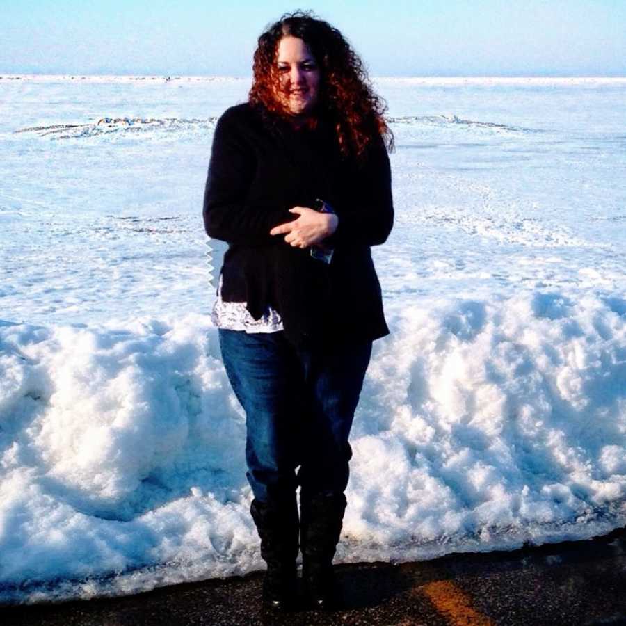 A woman struggling with her mental health stands out in the snow