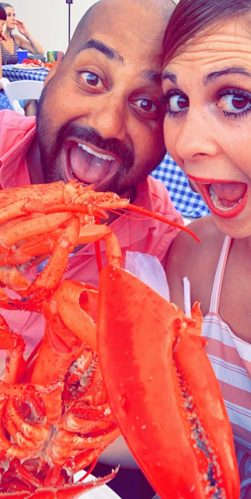 Man and woman looking at lobster