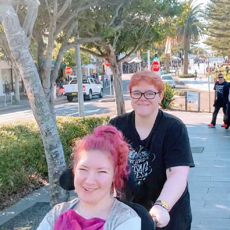 A woman with cerebral palsy and her partner go for a walk