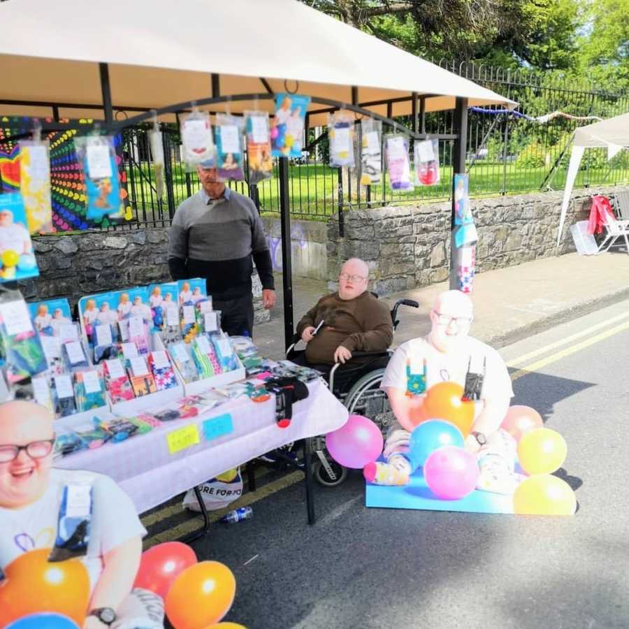 Two people at a pop-up shop for socks