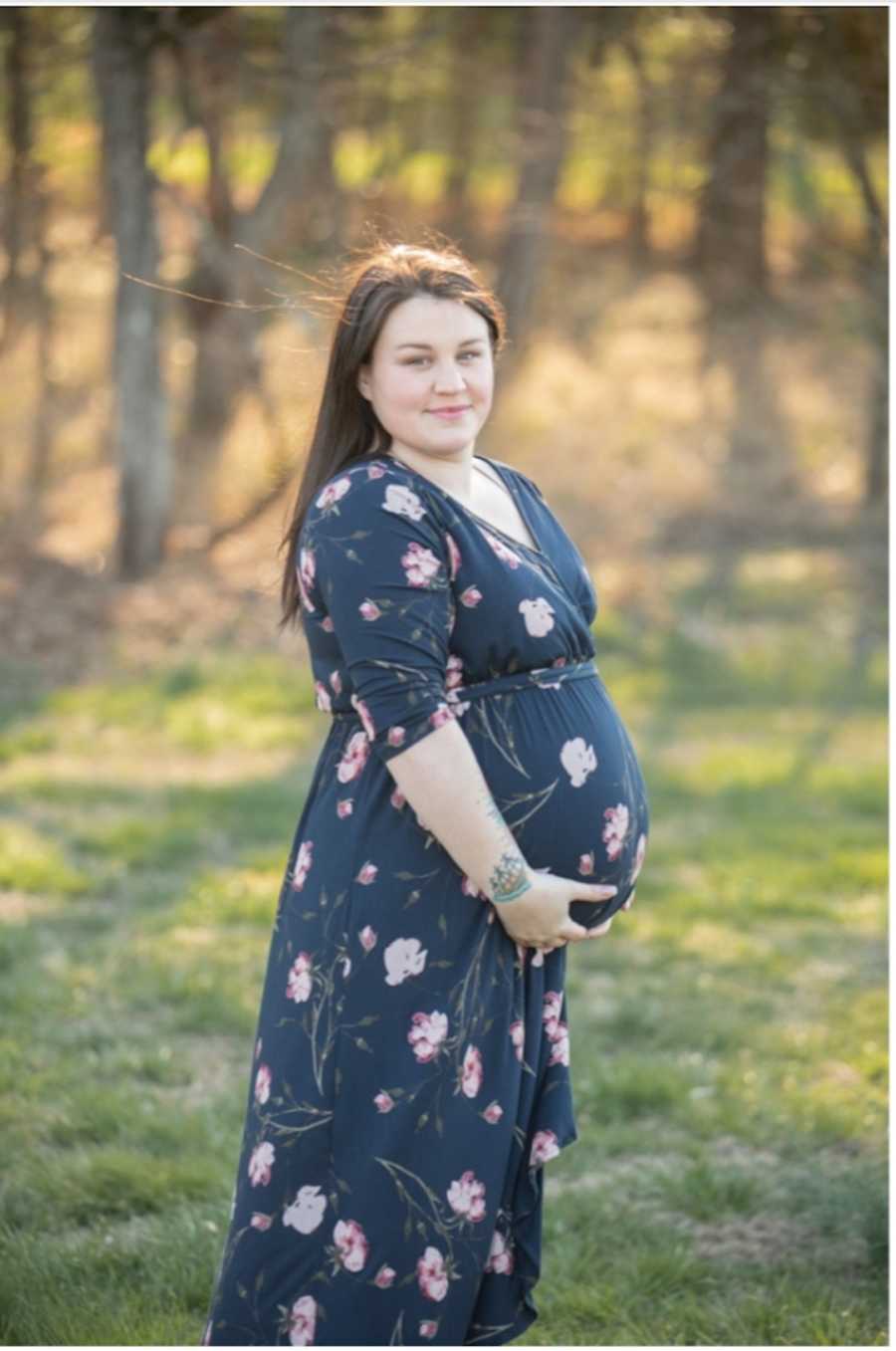 maternity photo of woman in forest