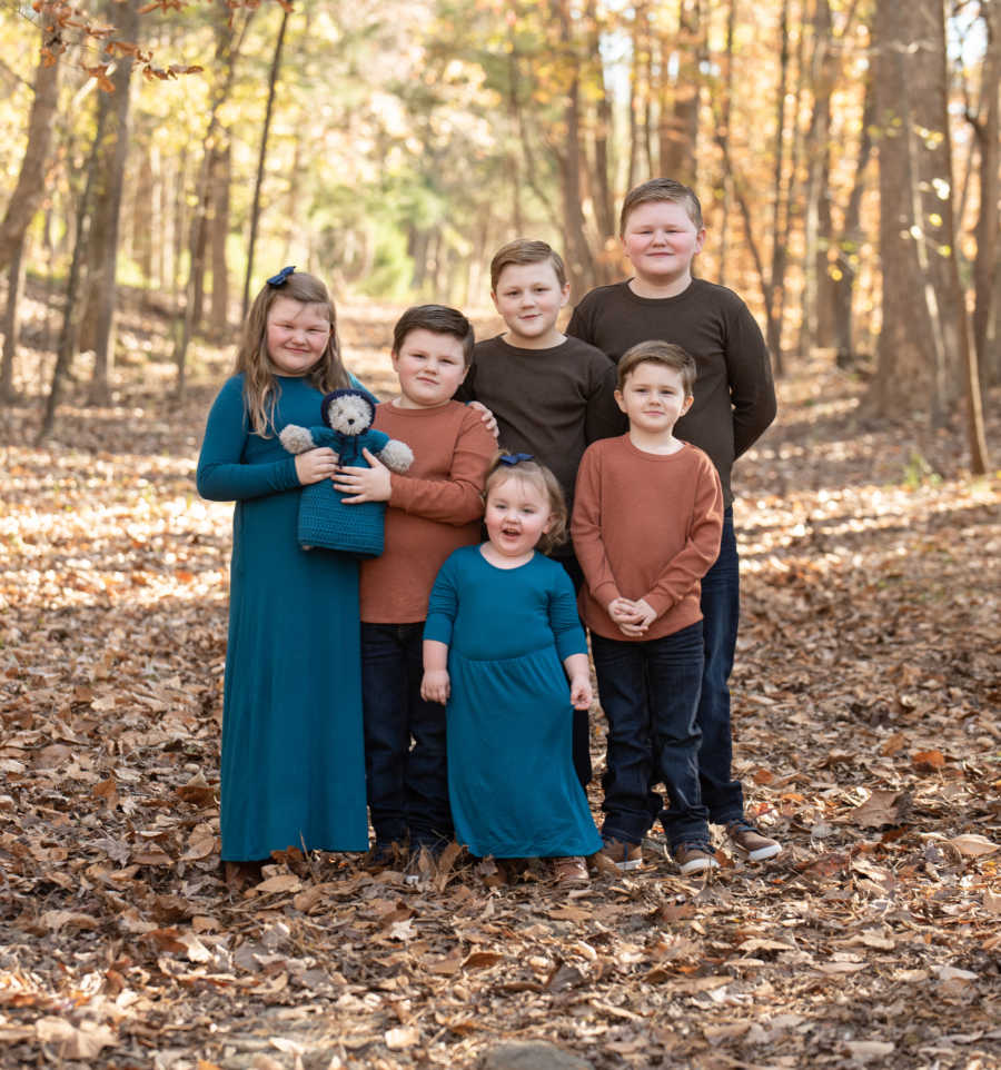 5 children wearing matching outfits