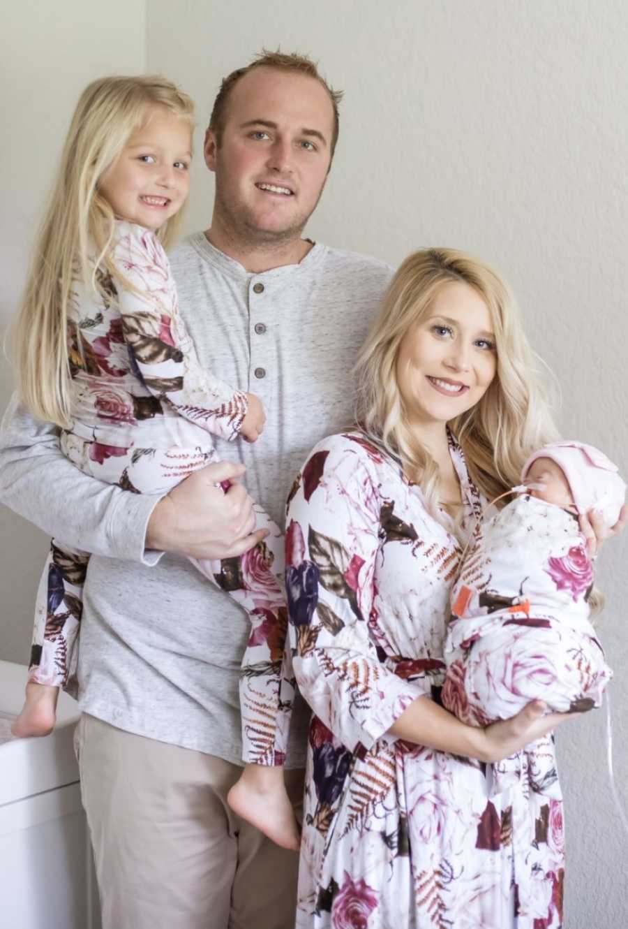 Family of four take photos in matching outfits to celebrate the life of their newborn baby girl