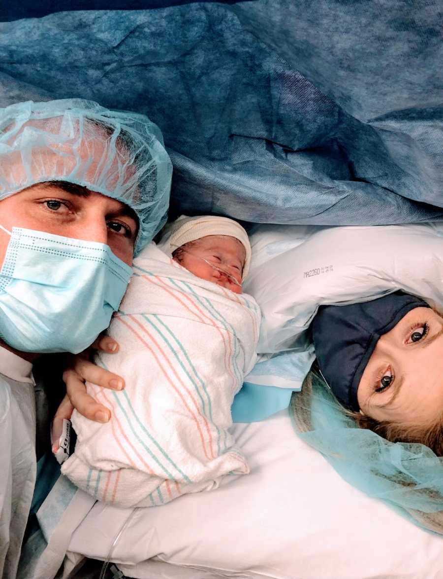 Couple take selfie with their newborn with Alobar Holoprosencephaly after C-section birth