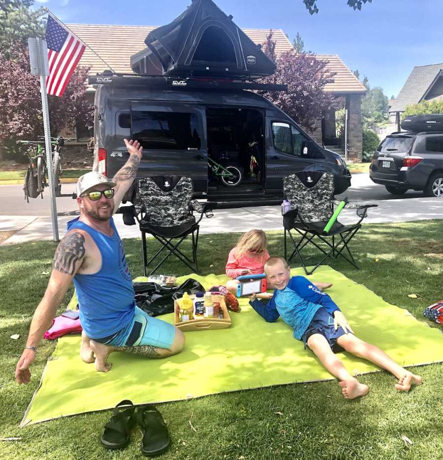 family in front of a van