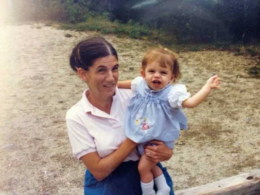 woman holding her daughter