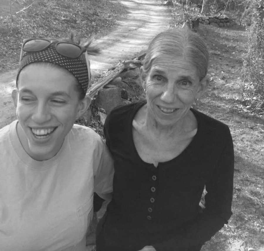 mom and daughter standing outside