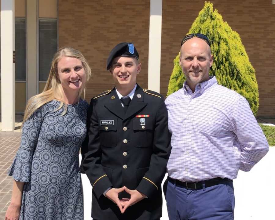 parents with their son in an army uniform