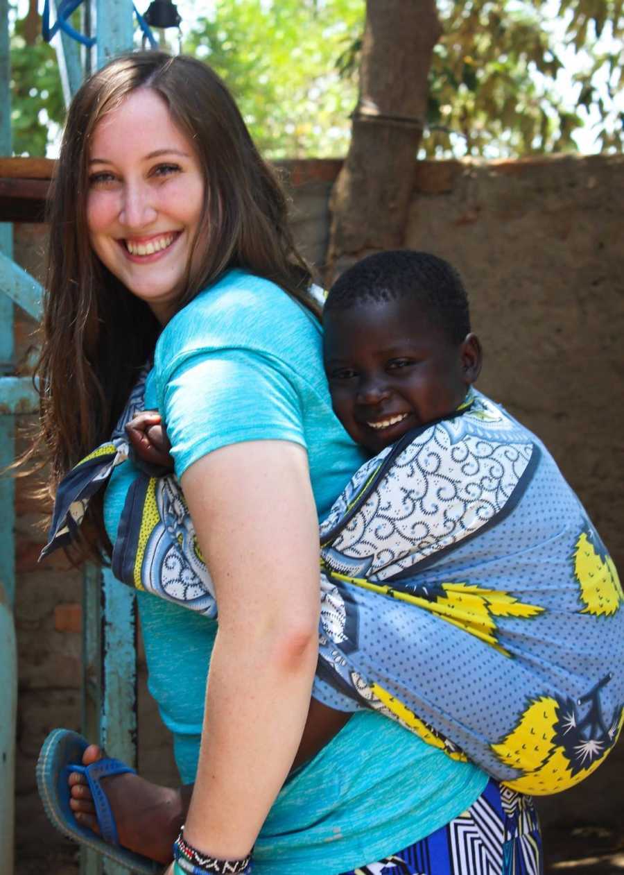 woman with a girl on her back