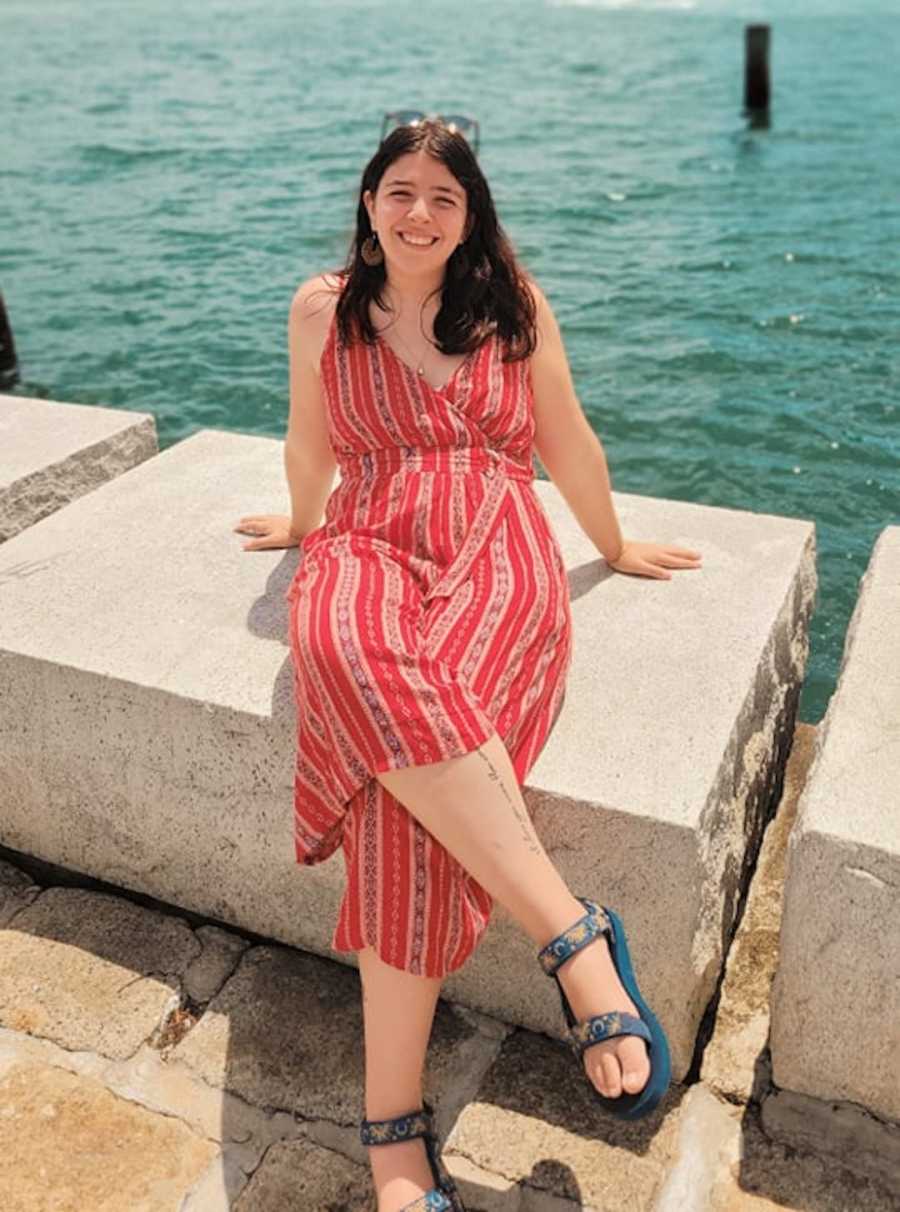 girl sitting by the water