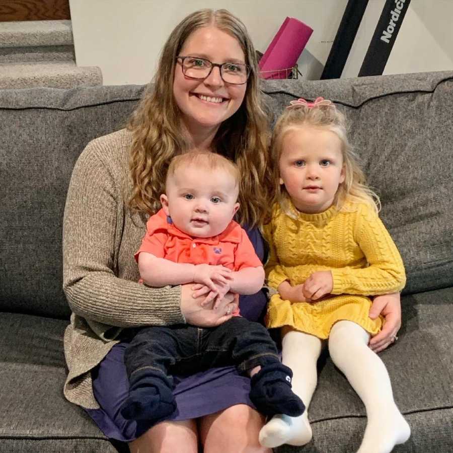 mom with her two kids on the couch