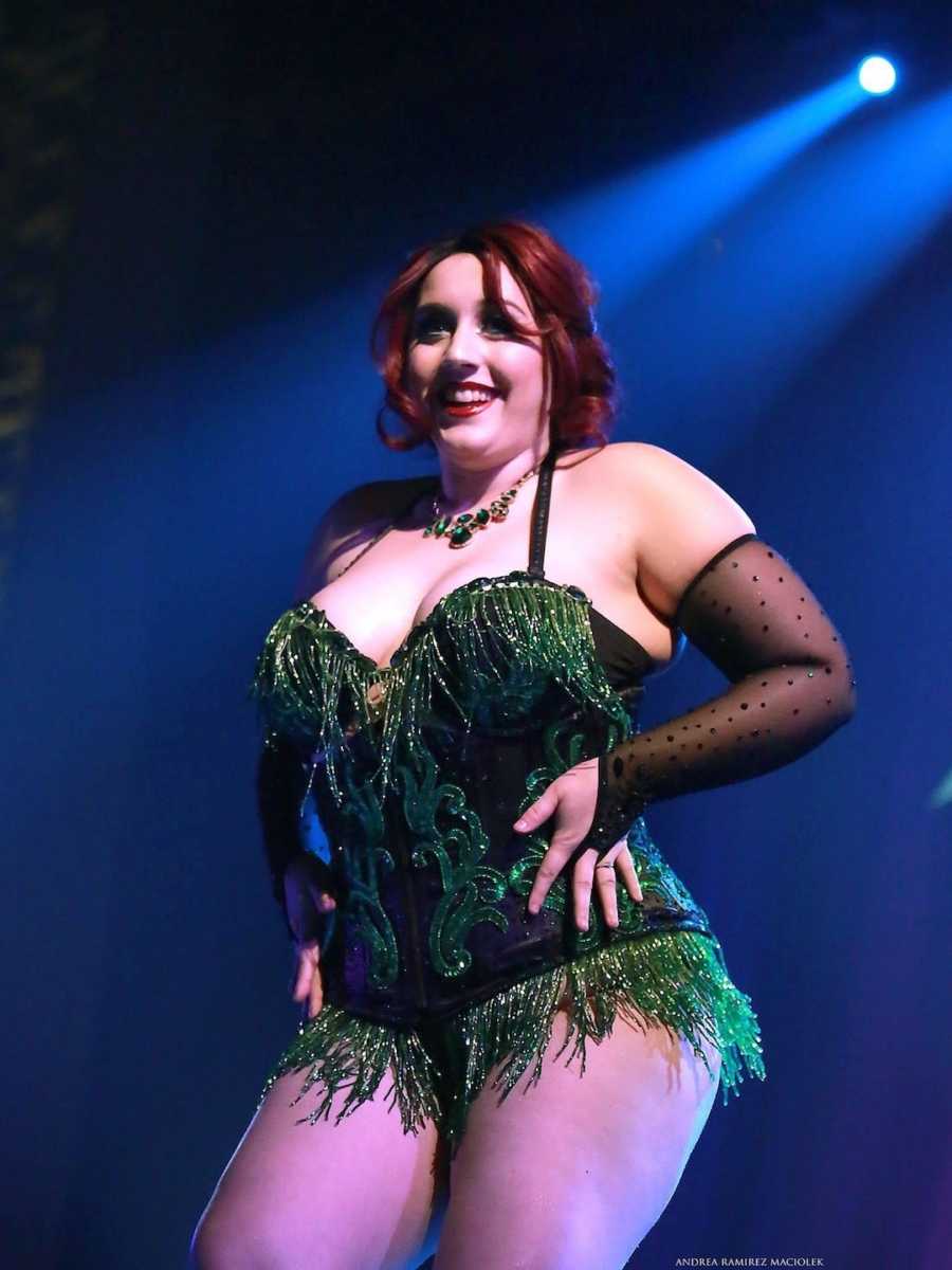 woman in black and green corset top at burlesque show