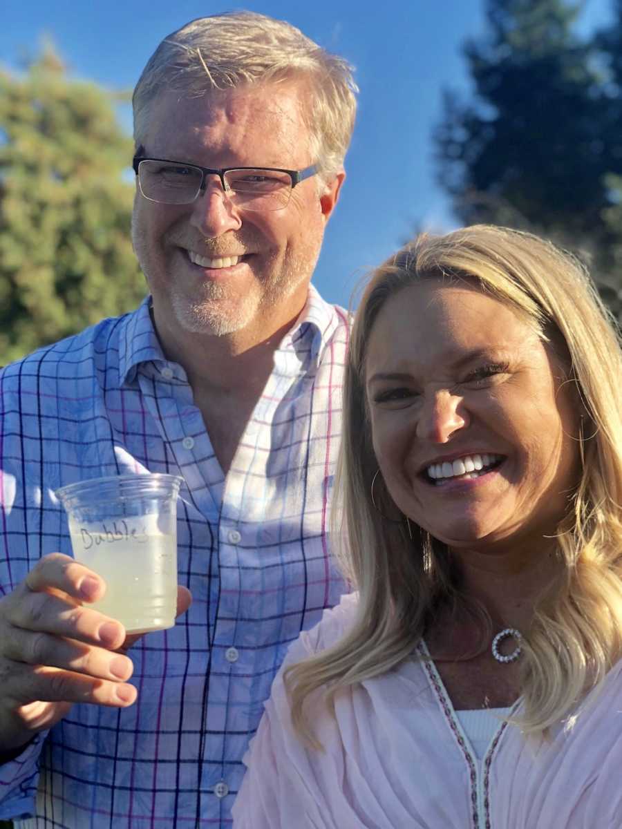 couple holding drinks