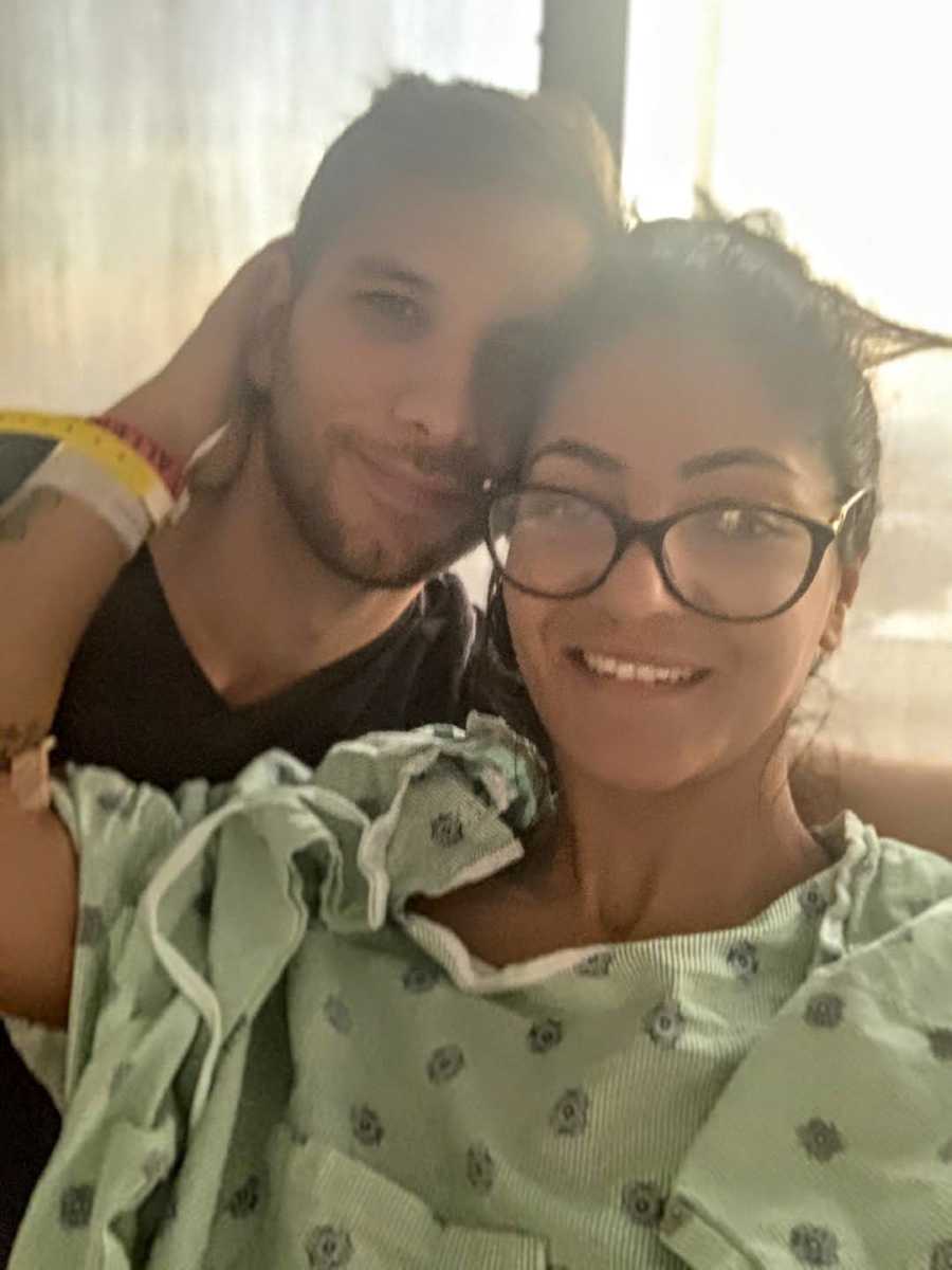 woman in hospital gown with boyfriend