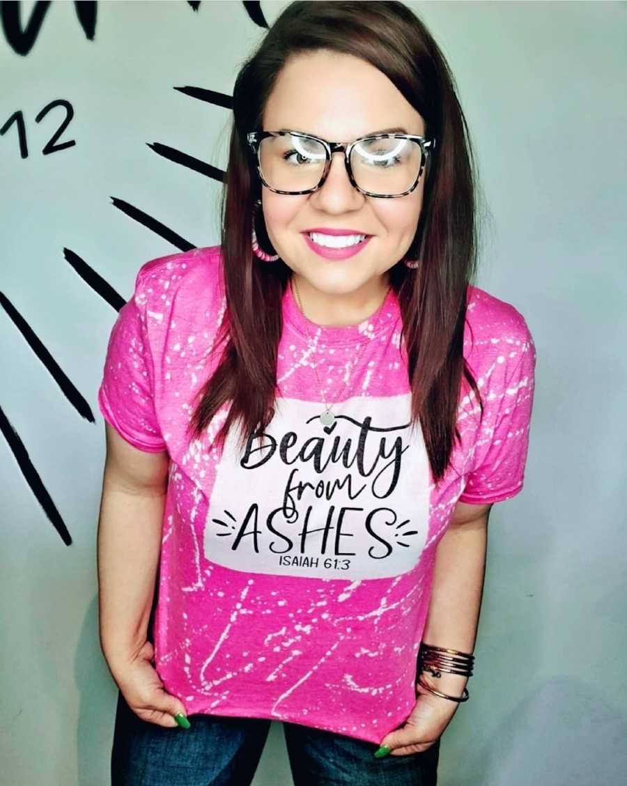 woman wearing "beauty from ashes" shirt