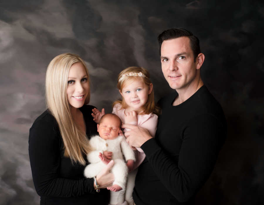 family portrait- mom, dad, young girl, young boy smiling