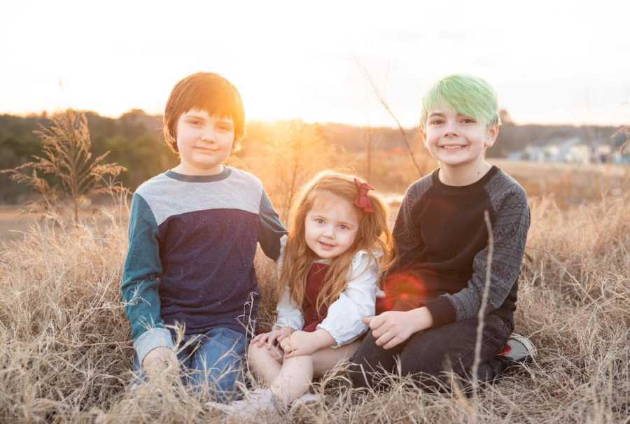 three kids together outside 