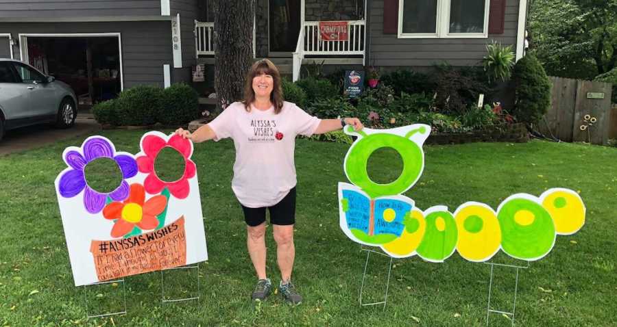 woman standing in front of signs