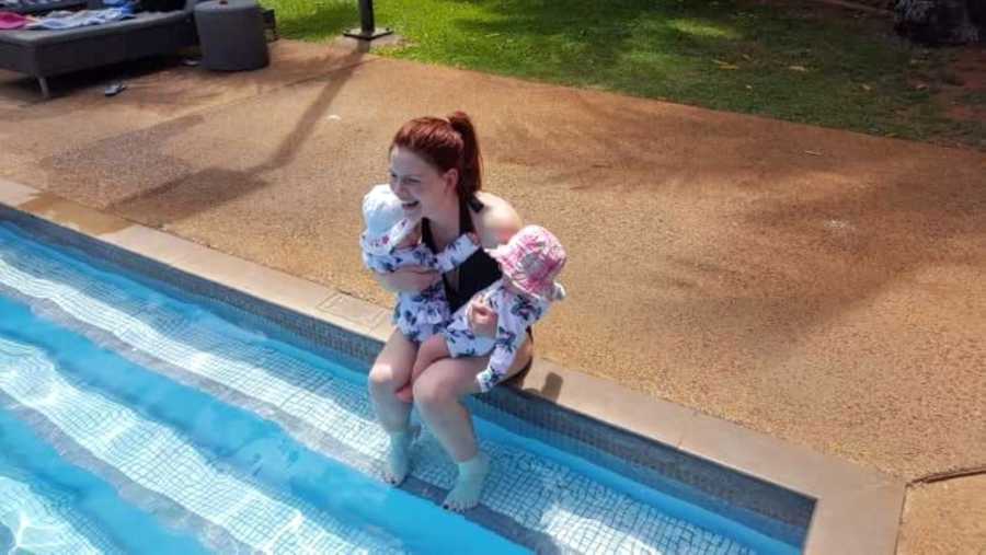 Girl mom of three enjoys a day at the pool with her twins 