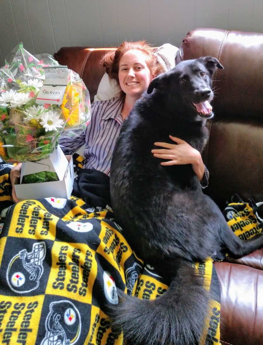 woman recovering from surgery with her dog