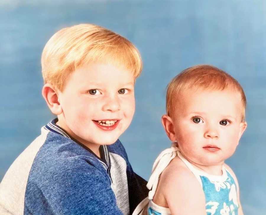 A young boy and his baby sister