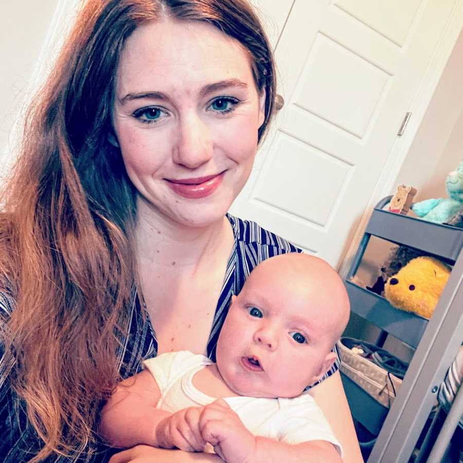 Stay at home mom takes selfie with her newborn son