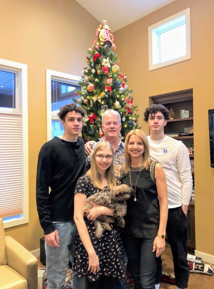 family portrait in front of Christmas tree