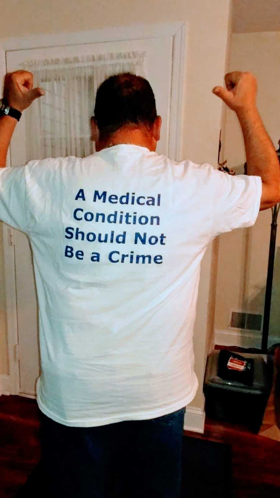 Man who recovered from Auto-Brewery Syndrome wears a t-shirt that says "A medical condition should not be a crime"