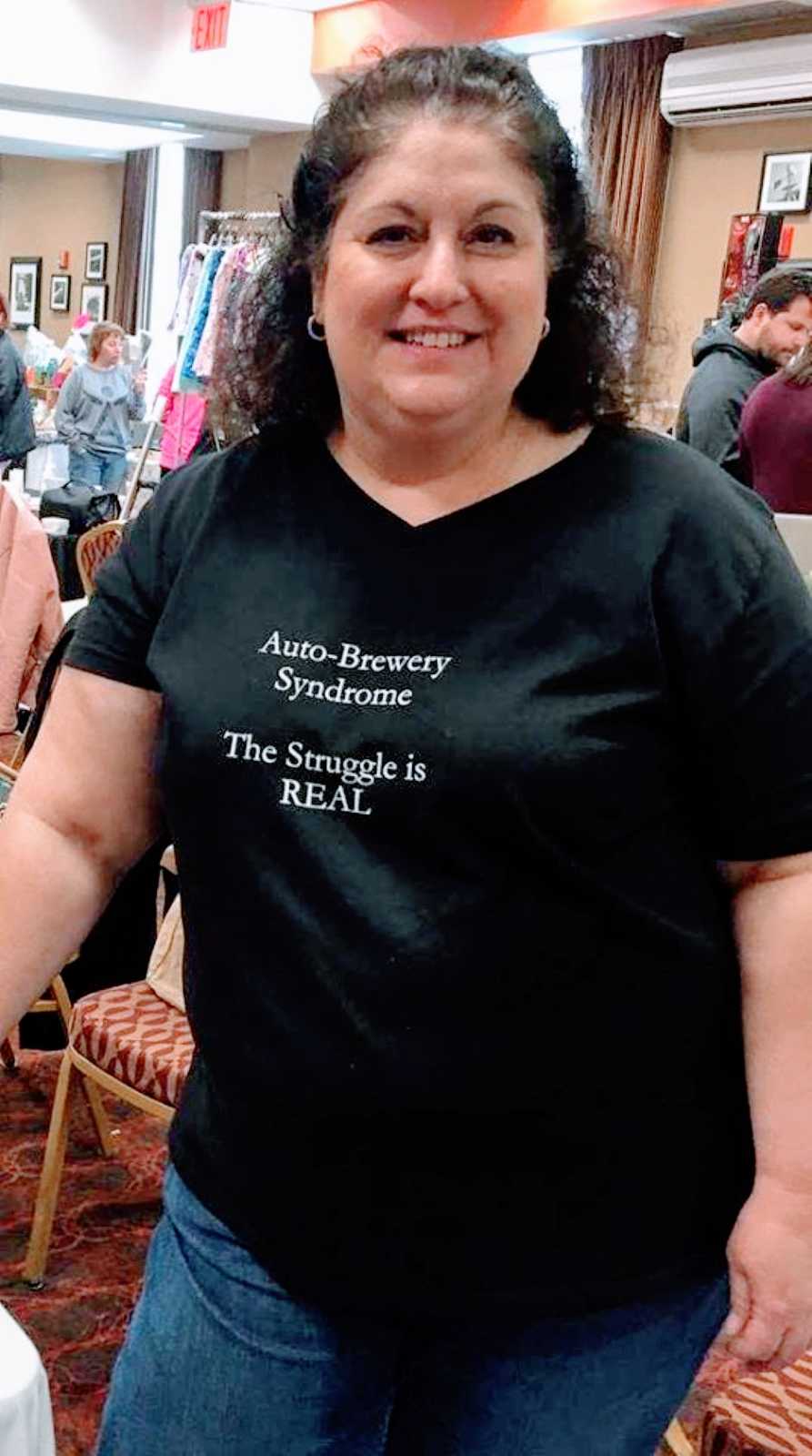 Woman advocating for Auto-Brewery Syndrome wears shirt that reads "Auto-Brewery Syndrome, The struggle is REAL"